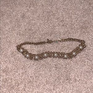 Gold pearl chicken necklace.